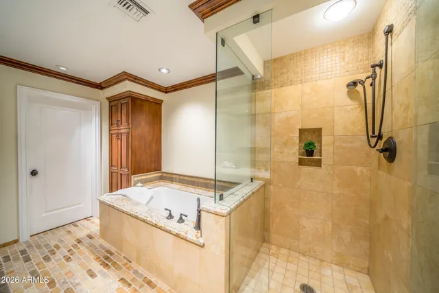 a bathroom with a tub and shower