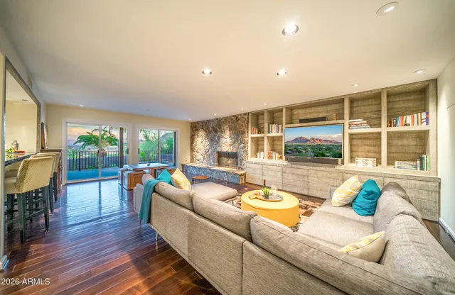 a living room with furniture and a large window
