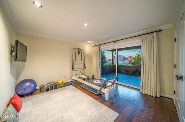 a view of a room with wooden floor and bedroom