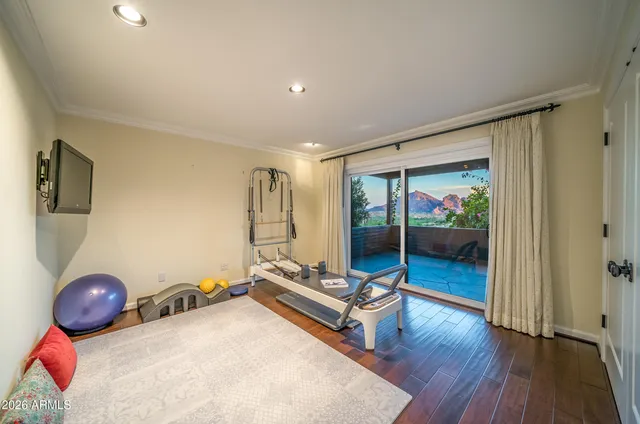 a view of a room with wooden floor and bedroom