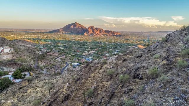 a view of a city with mountains in the background