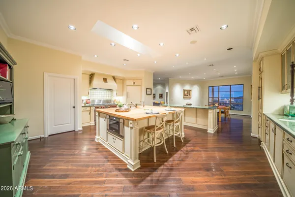 a large kitchen with stainless steel appliances lots of counter top space