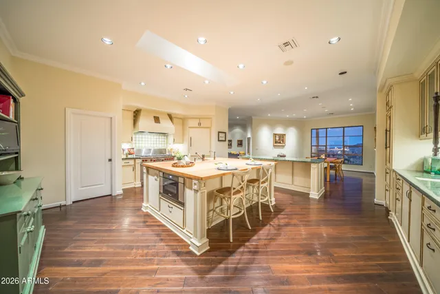 a large kitchen with stainless steel appliances lots of counter top space