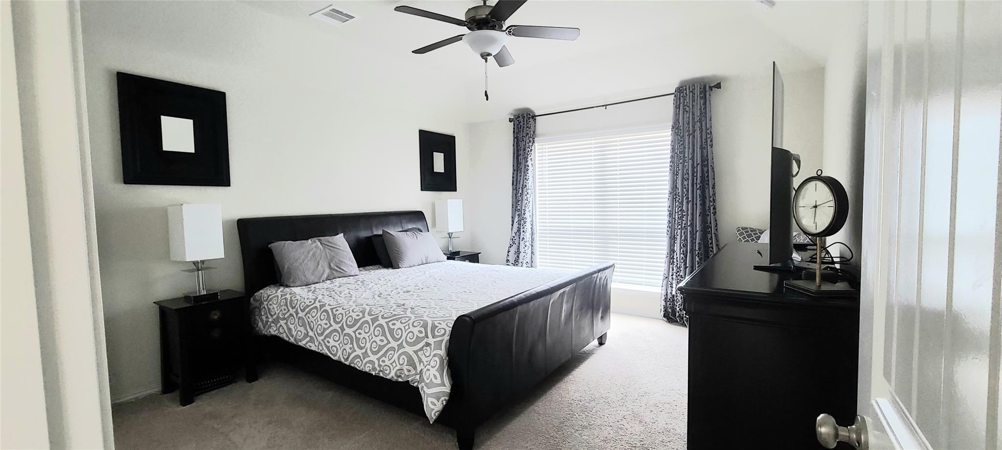 2710 Little Caney Way Conroe, TX 77301 - Photo 12 of 25 a bedroom with a bed and a closet