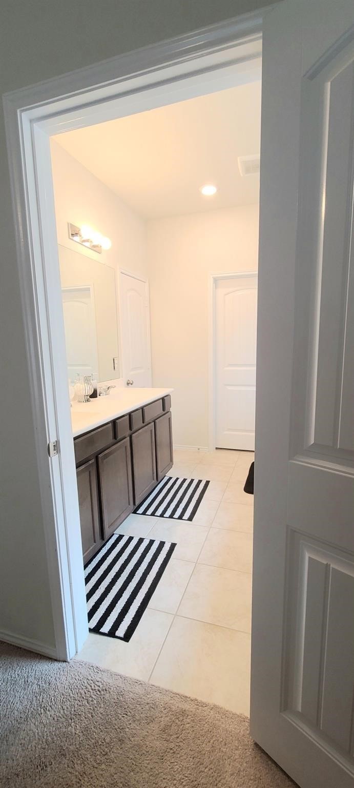 2710 Little Caney Way Conroe, TX 77301 - Photo 15 of 25 a view of a bedroom with wooden floor and furniture
