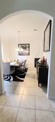 a kitchen with stainless steel appliances a sink a stove a refrigerator and cabinets