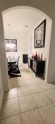 a kitchen with a stove a refrigerator and cabinets