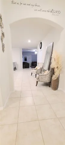 a view of a room with furniture and windows