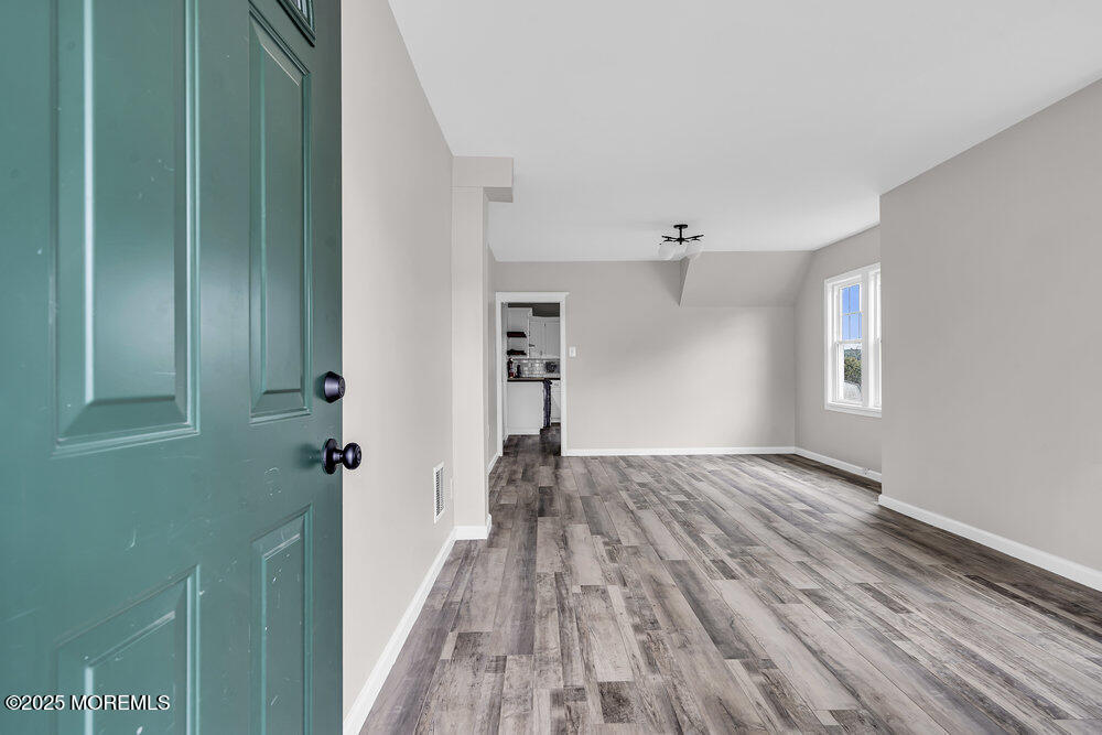 37 Knight Avenue Runnemede, NJ 08078 - Photo 12 of 50 a view of a hallway with wooden floor and closet