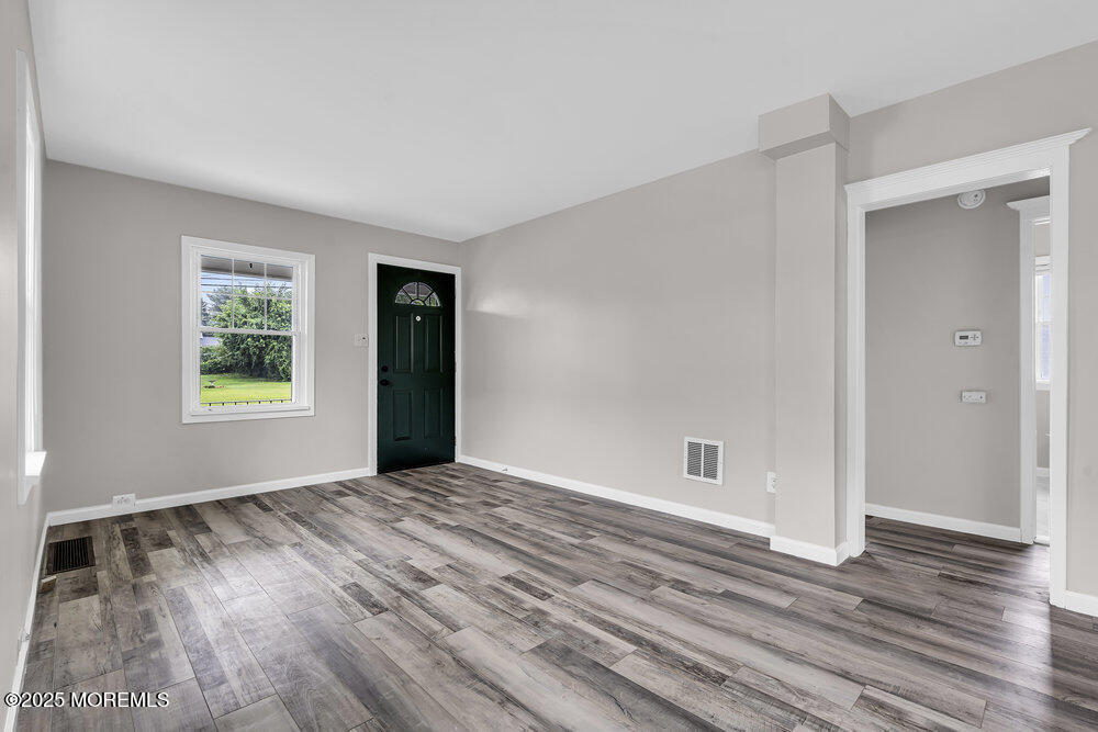 37 Knight Avenue Runnemede, NJ 08078 - Photo 21 of 50 a view of an empty room with window and hardwood floor