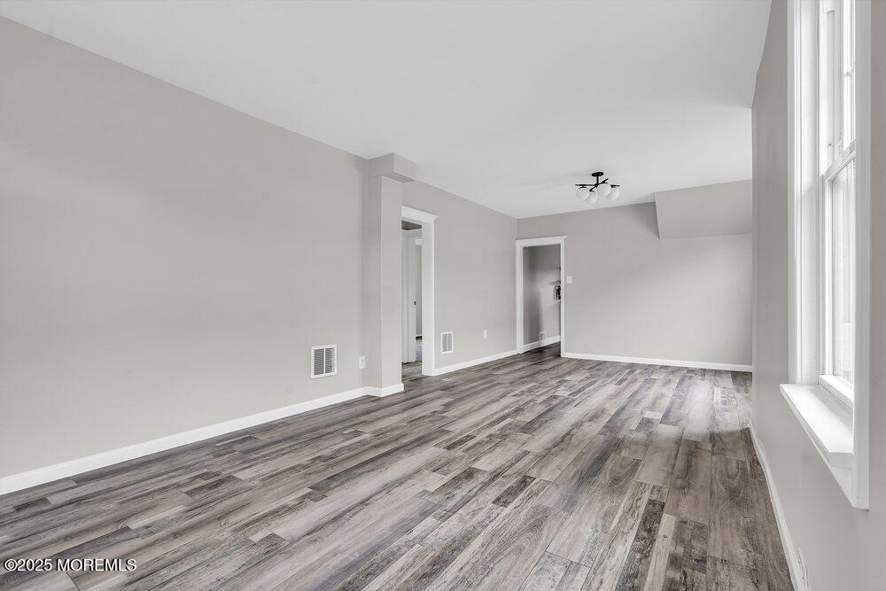 37 Knight Avenue Runnemede, NJ 08078 - Photo 24 of 50 a view of empty room with wooden floor and fan
