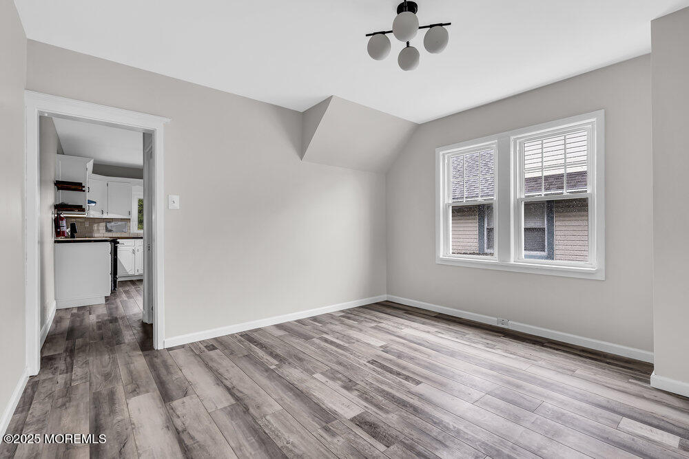 37 Knight Avenue Runnemede, NJ 08078 - Photo 26 of 50 a view of empty room with wooden floor and fan