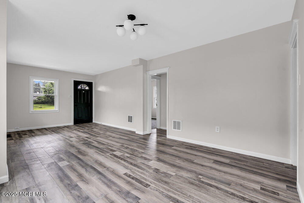 37 Knight Avenue Runnemede, NJ 08078 - Photo 27 of 50 a view of empty room with wooden floor and fan