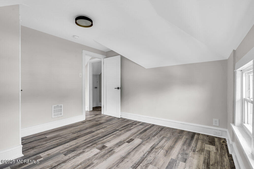 37 Knight Avenue Runnemede, NJ 08078 - Photo 46 of 50 wooden floor in an empty room with a window