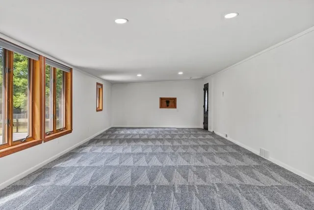 a view of an empty room and window