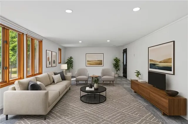 a living room with furniture and a large window