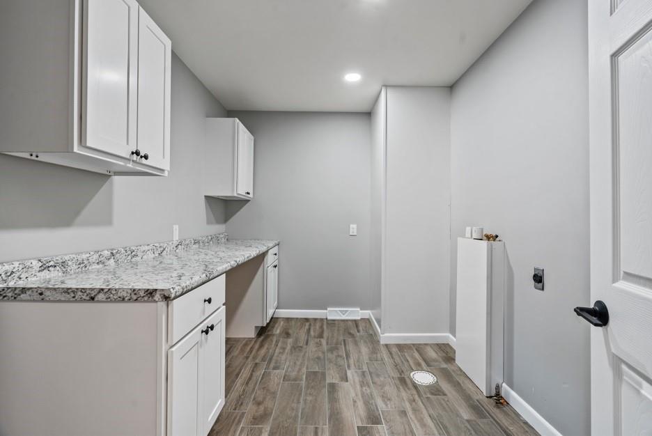 128 McGinley Road Chicora, PA 16025 - Photo 26 of 36 a kitchen with granite countertop a sink and cabinets