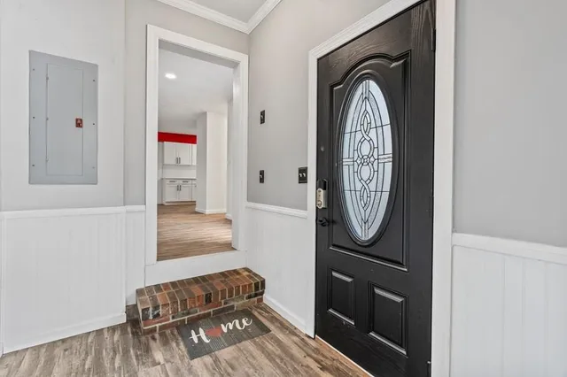 a view of a livingroom with furniture and front door