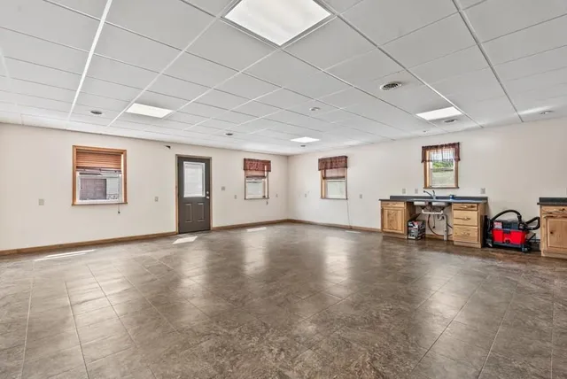a view of a livingroom with hardwood and furniture