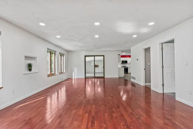 a view of livingroom with wooden floor and window