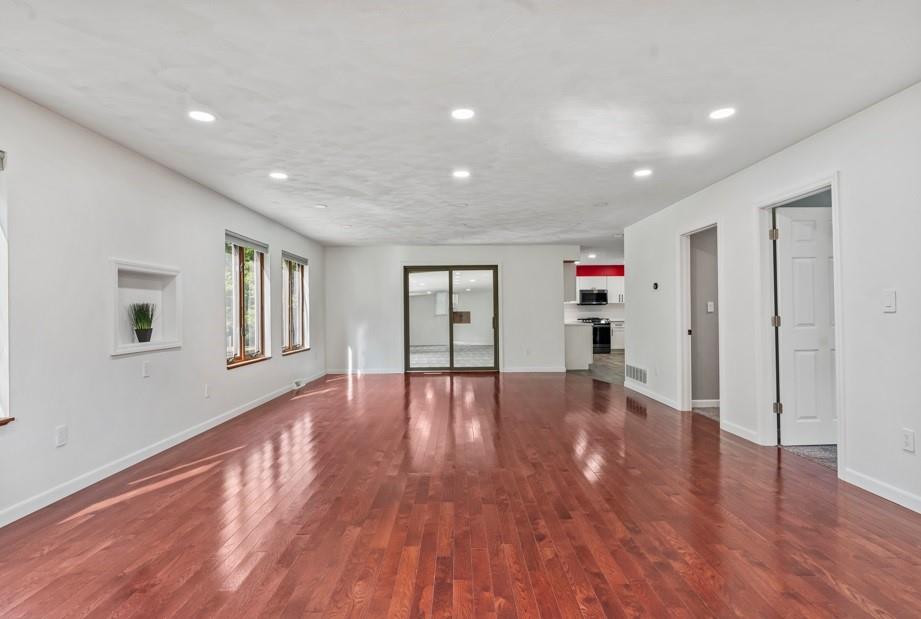 128 McGinley Road Chicora, PA 16025 - Photo 7 of 36 a view of livingroom with wooden floor and window