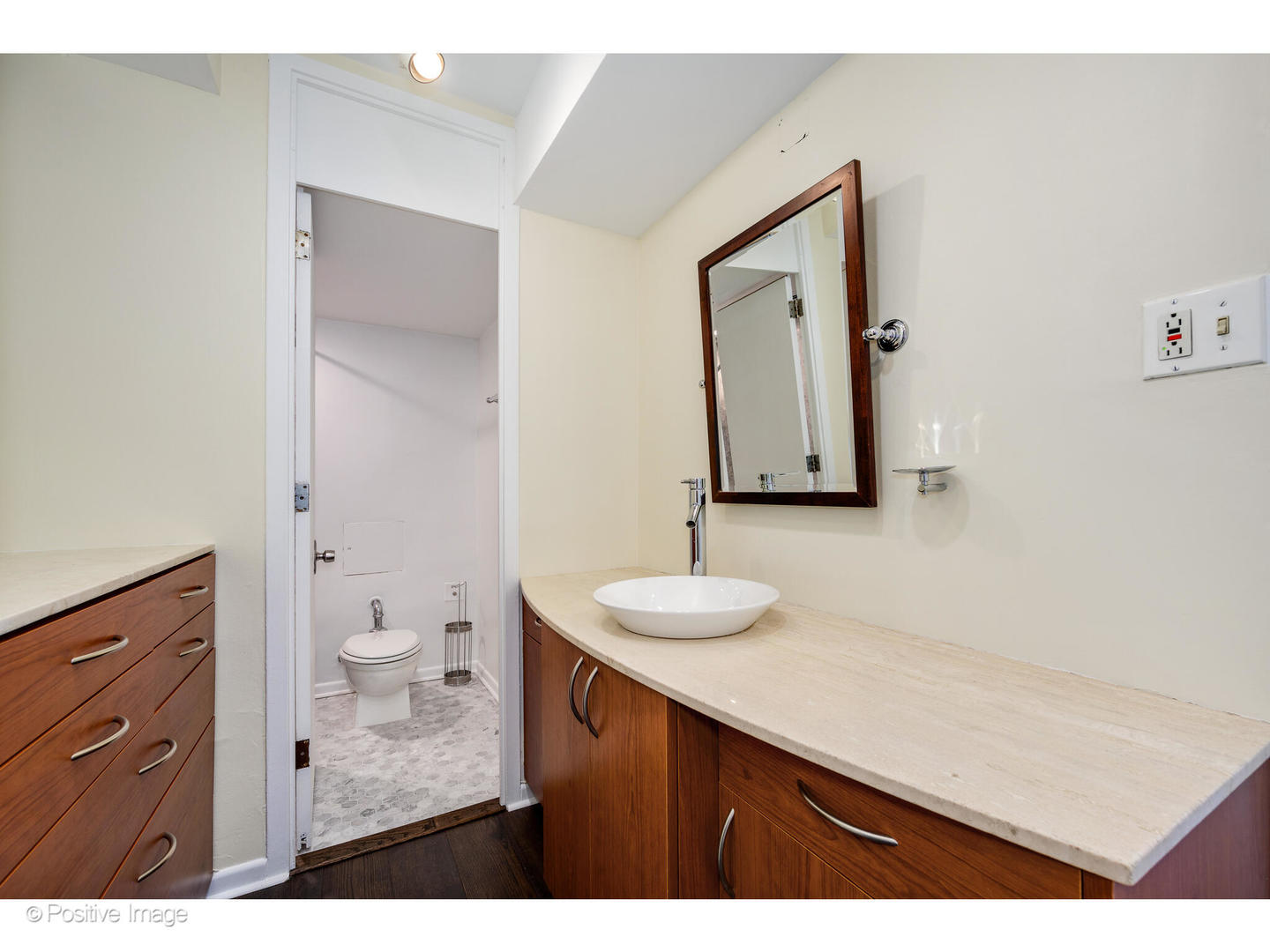 1300 North Astor Street, Unit 10D Chicago, IL 60610 - Photo 14 of 25 a bathroom with a sink vanity and mirror