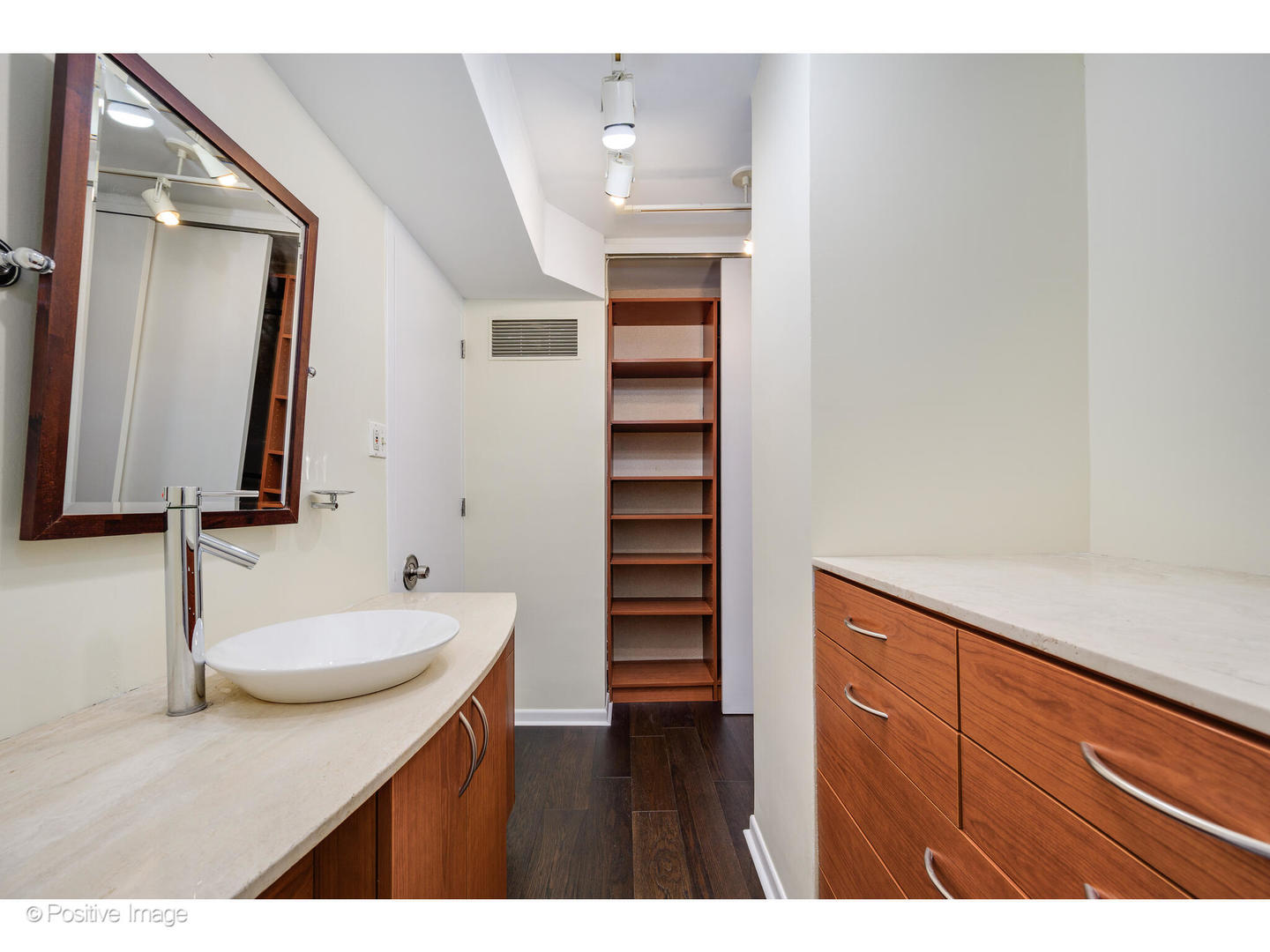 1300 North Astor Street, Unit 10D Chicago, IL 60610 - Photo 15 of 25 a bathroom with a sink and a mirror