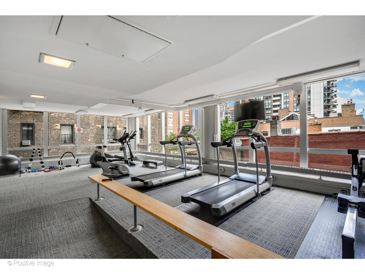 1300 North Astor Street, Unit 10D Chicago, IL 60610 - Photo 19 of 25 a living room with lots of furniture and windows