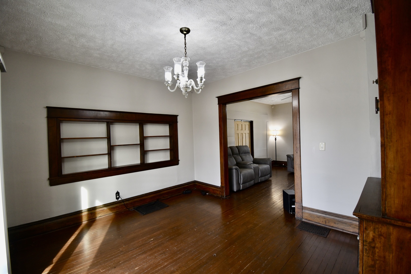 203 South Denver Street Bloomington, IL 61701 - Photo 14 of 54 a view of a room with wooden floor and chandelier