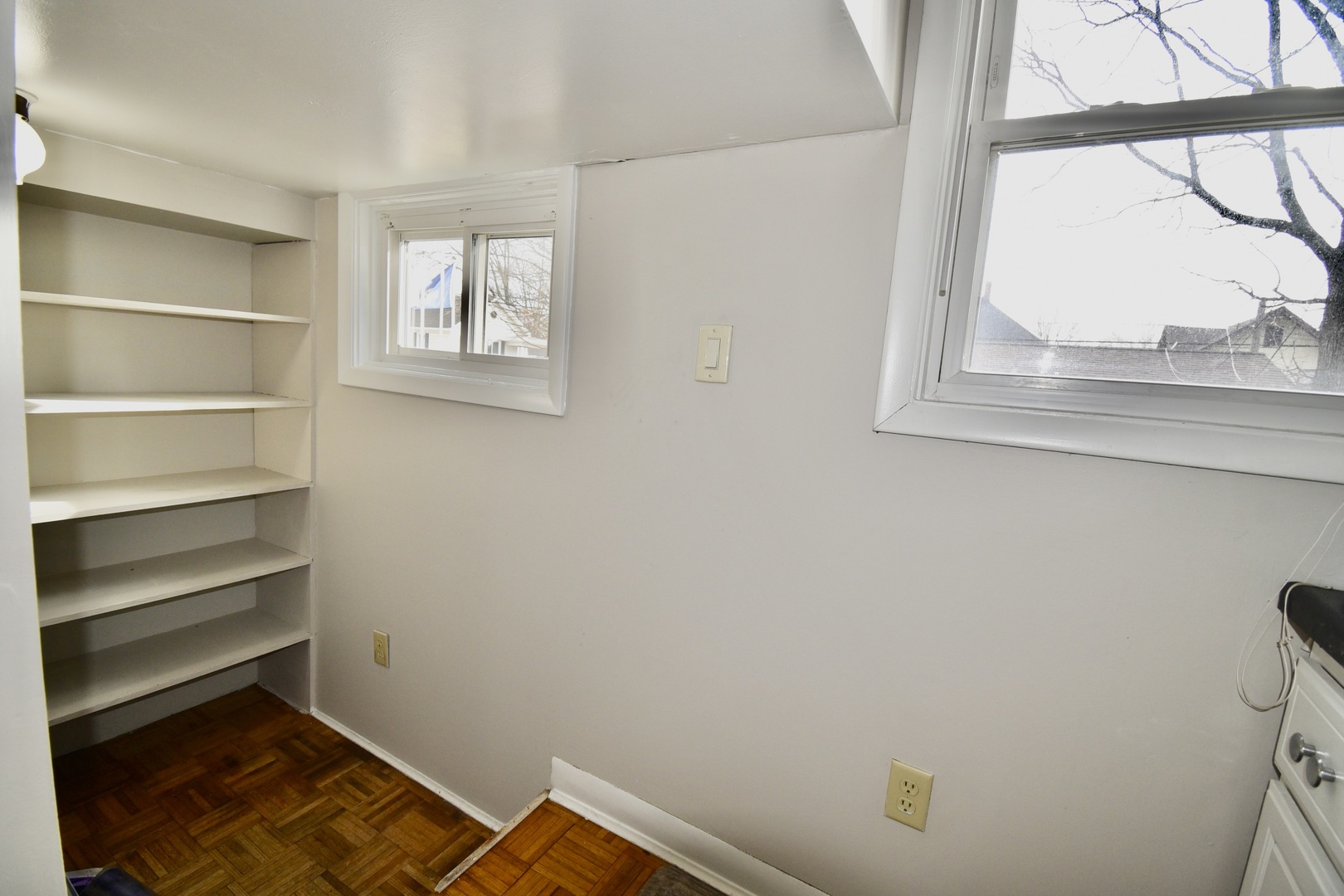 203 South Denver Street Bloomington, IL 61701 - Photo 19 of 54 a view of a room with rack on the wall and a window