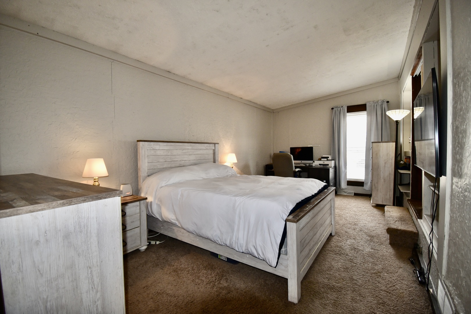 203 South Denver Street Bloomington, IL 61701 - Photo 21 of 54 a bedroom with a bed and a large mirror