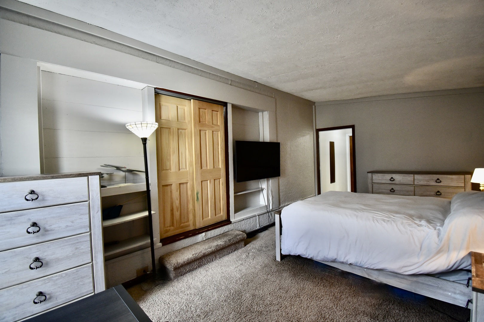 203 South Denver Street Bloomington, IL 61701 - Photo 23 of 54 a bedroom with a bed and a flat tv screen on dresser