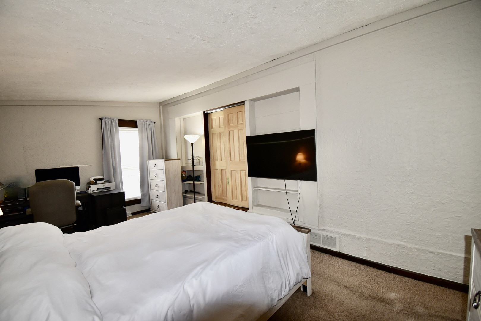 203 South Denver Street Bloomington, IL 61701 - Photo 24 of 54 a bedroom with a bed and a flat screen tv