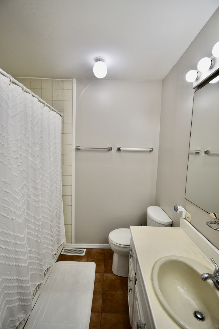 203 South Denver Street Bloomington, IL 61701 - Photo 25 of 54 a bathroom with a sink a toilet and shower