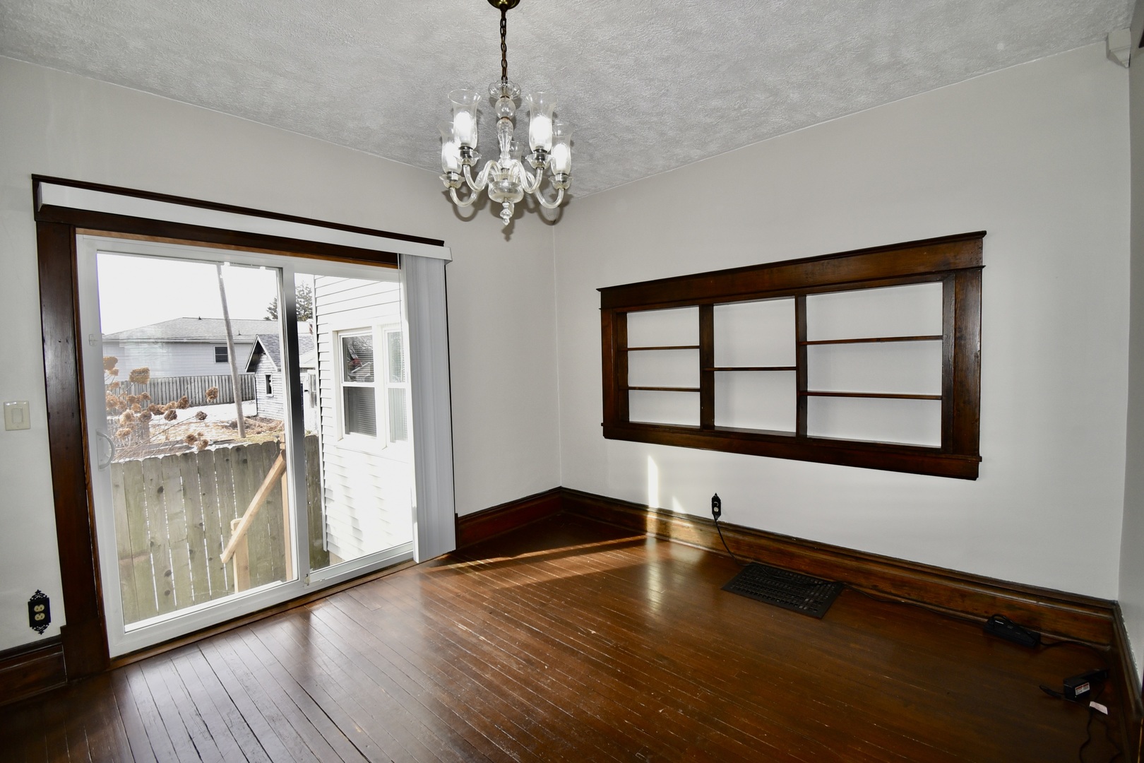203 South Denver Street Bloomington, IL 61701 - Photo 29 of 54 a view of an empty room with window and wooden floor