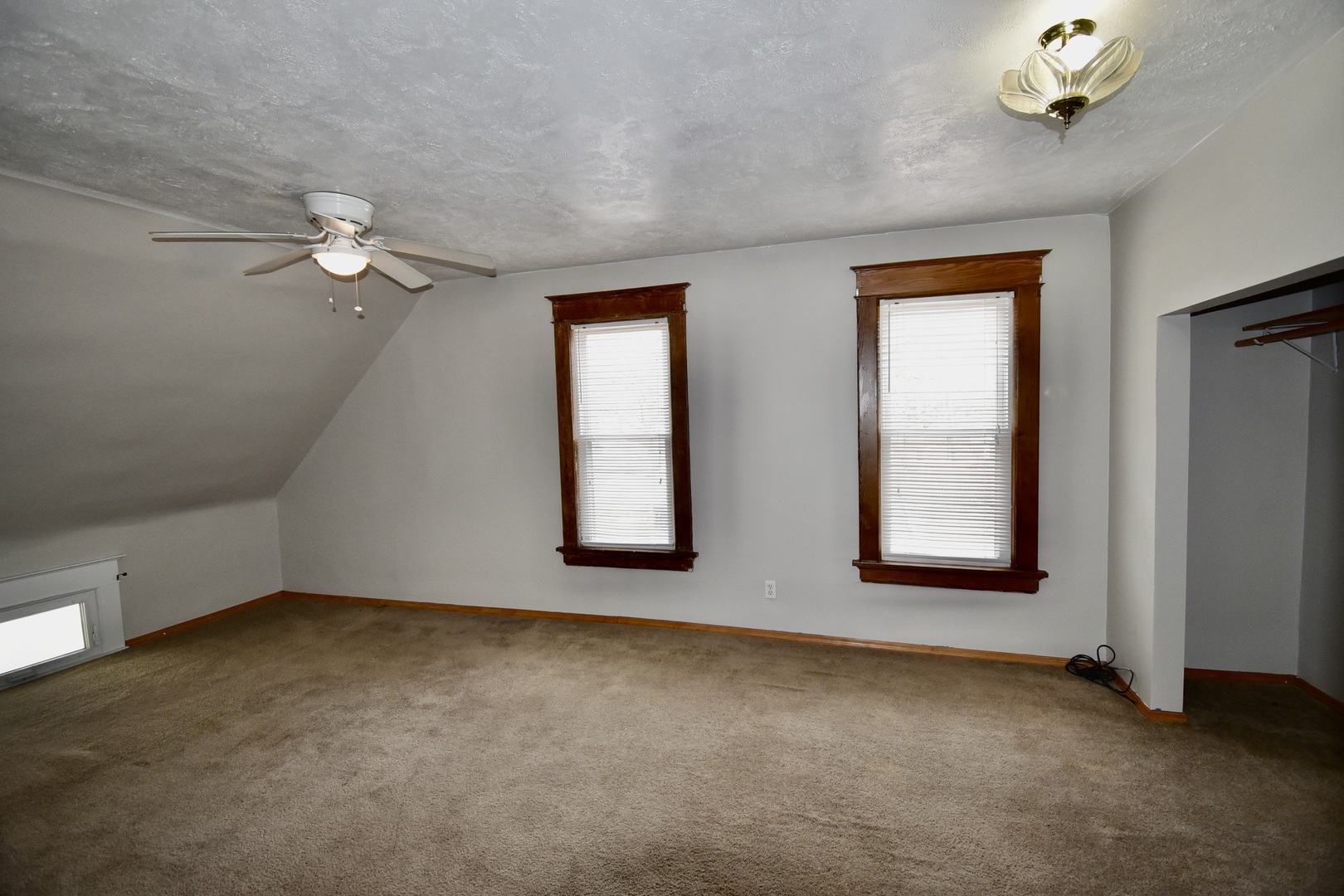 203 South Denver Street Bloomington, IL 61701 - Photo 36 of 54 an empty room with windows and fan