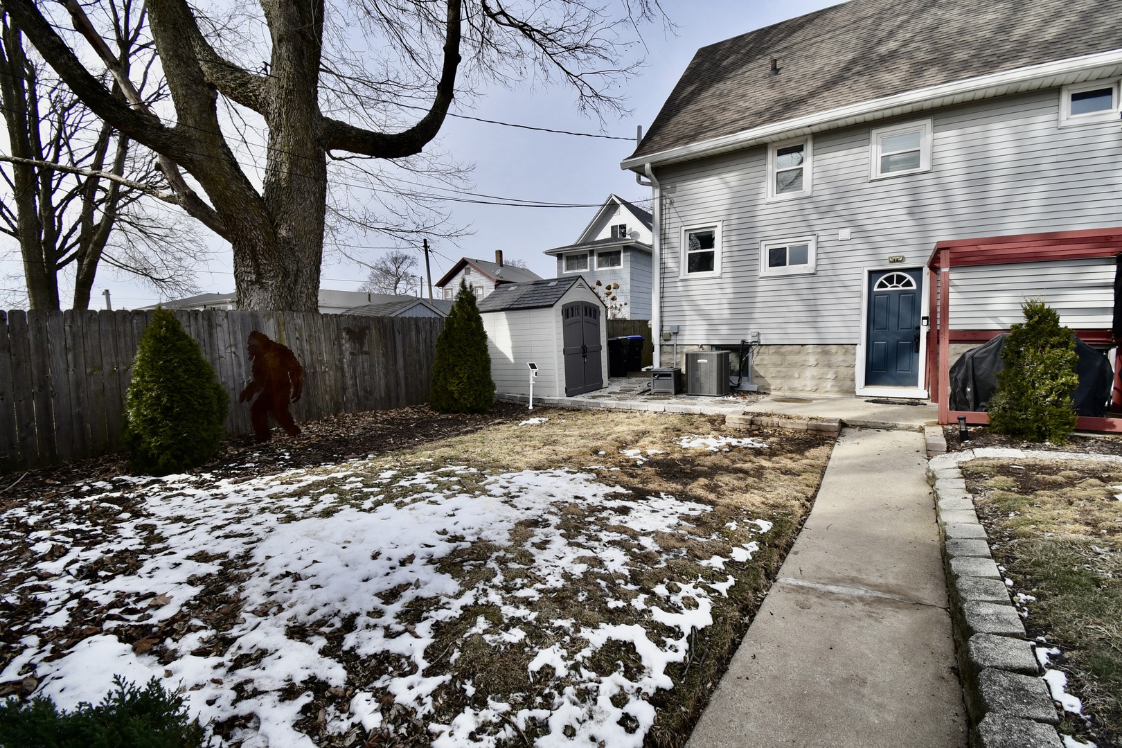 203 South Denver Street Bloomington, IL 61701 - Photo 4 of 54 a view of a house with a snow on the road