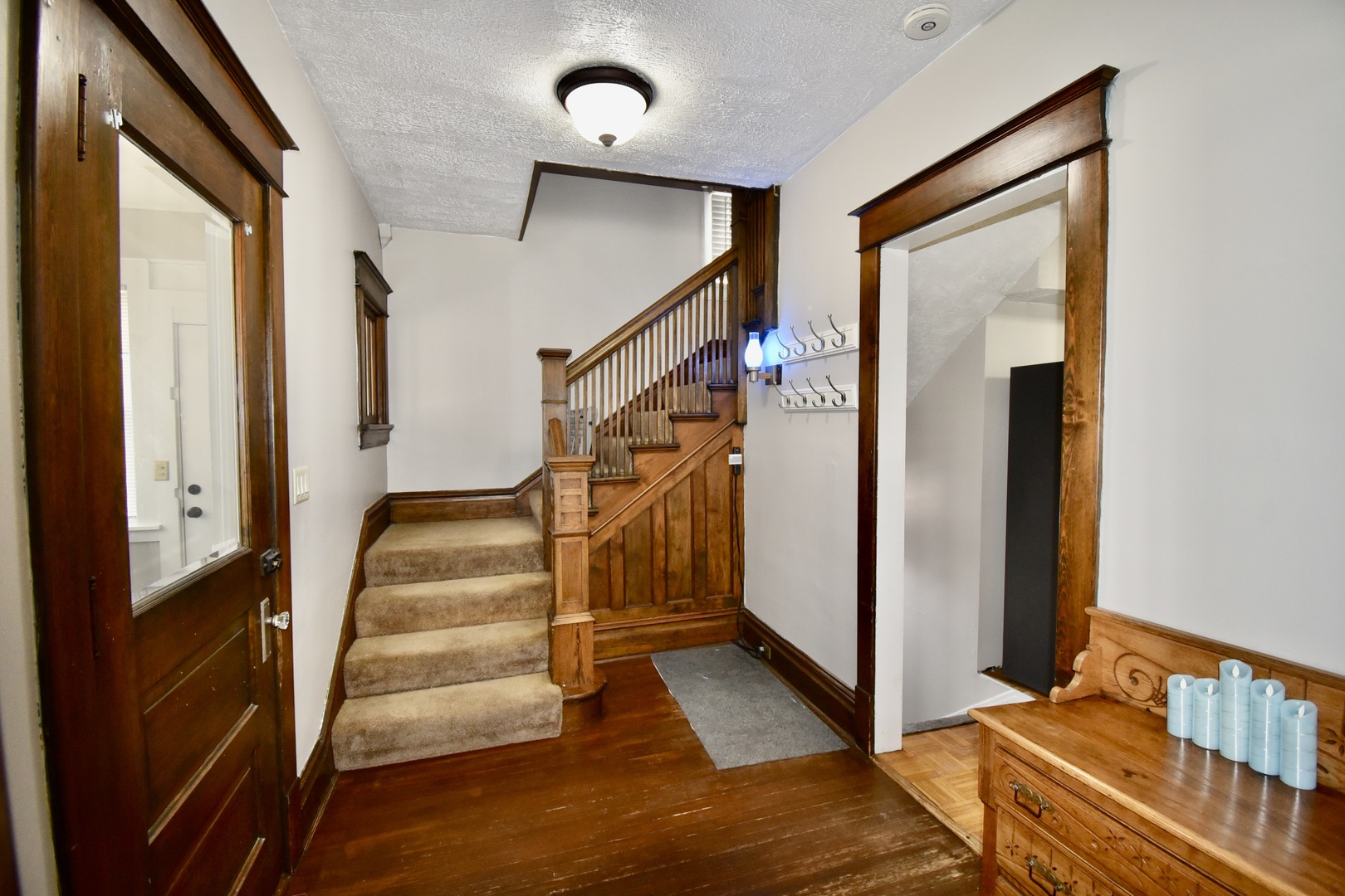 203 South Denver Street Bloomington, IL 61701 - Photo 8 of 54 a view of a hallway with staircase and white walls