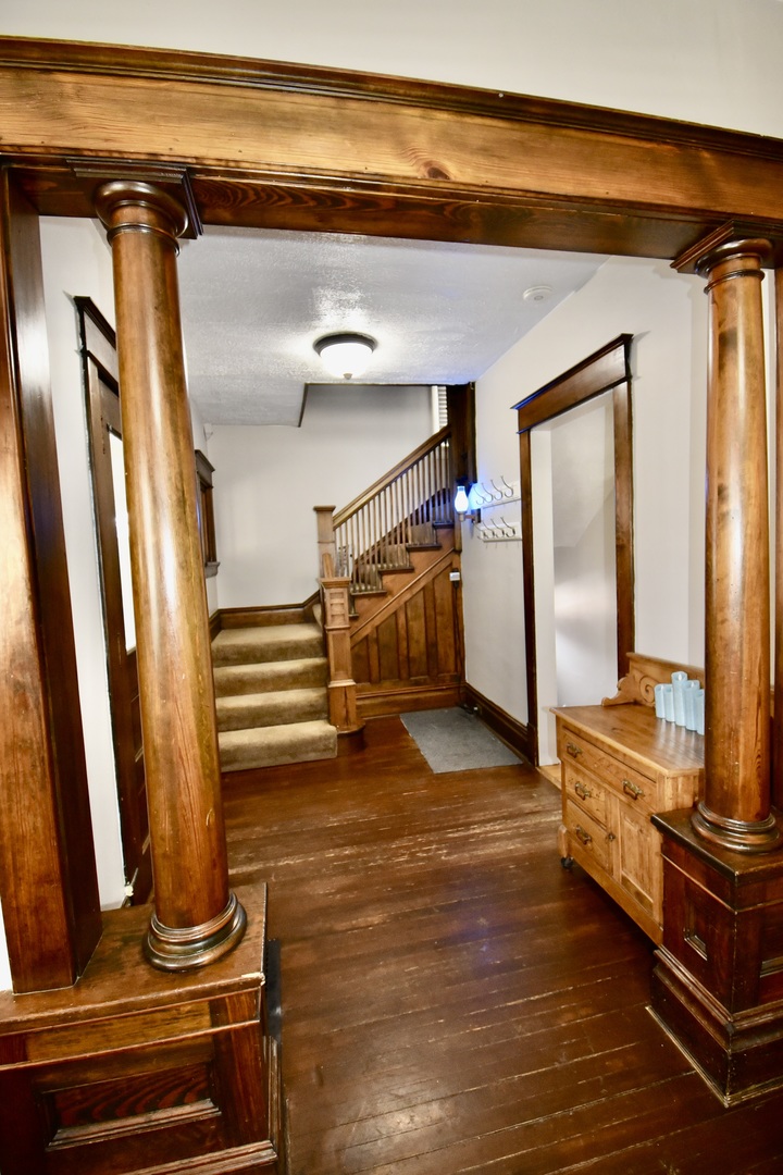 203 South Denver Street Bloomington, IL 61701 - Photo 9 of 54 a view of a room with wooden floor
