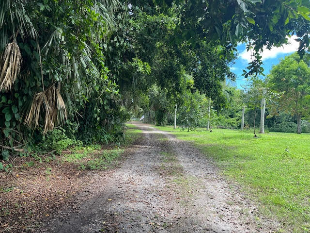9538 171st Street North Jupiter, FL 33478 - Photo 16 of 16 a view of outdoor space with trees all around
