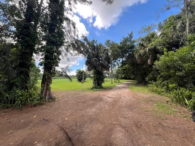 9538 171st Street North Jupiter, FL 33478 - Photo 4 of 16 a view of outdoor space with tree s