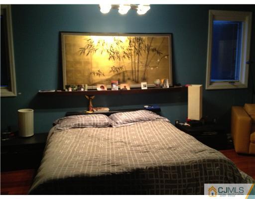 153 Redpine Loop Old Bridge, NJ 08857 - Photo 20 of 25 a bedroom with a bed and window
