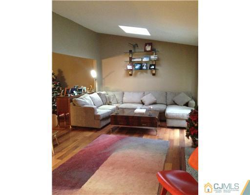 153 Redpine Loop Old Bridge, NJ 08857 - Photo 3 of 25 a living room with furniture and a lamp