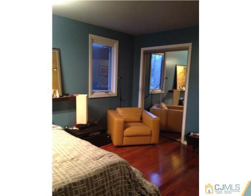153 Redpine Loop Old Bridge, NJ 08857 - Photo 22 of 25 a bedroom with bed and a couch