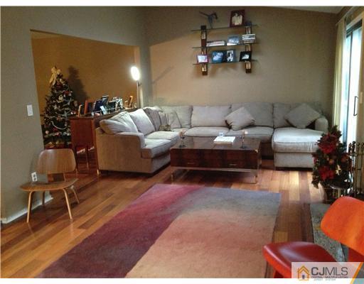 153 Redpine Loop Old Bridge, NJ 08857 - Photo 4 of 25 a living room with furniture and wooden floor