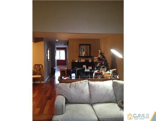 153 Redpine Loop Old Bridge, NJ 08857 - Photo 5 of 25 a living room with furniture and a wooden floor