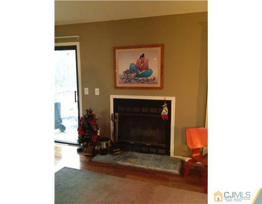153 Redpine Loop Old Bridge, NJ 08857 - Photo 6 of 25 a living room with furniture and a fireplace