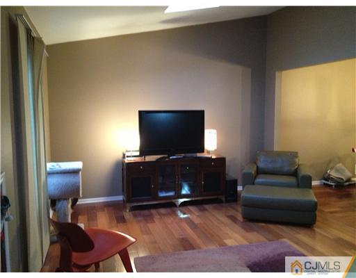 153 Redpine Loop Old Bridge, NJ 08857 - Photo 7 of 25 a living room with furniture and a flat screen tv