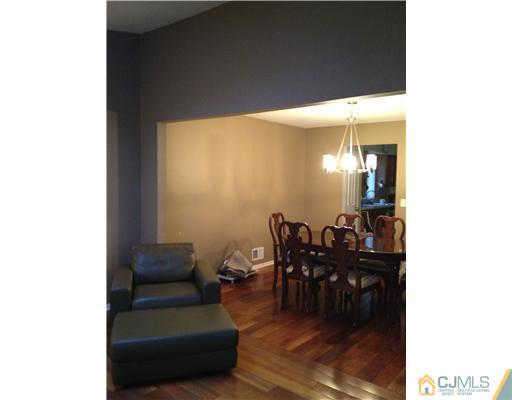 153 Redpine Loop Old Bridge, NJ 08857 - Photo 8 of 25 a living room with furniture and dining table