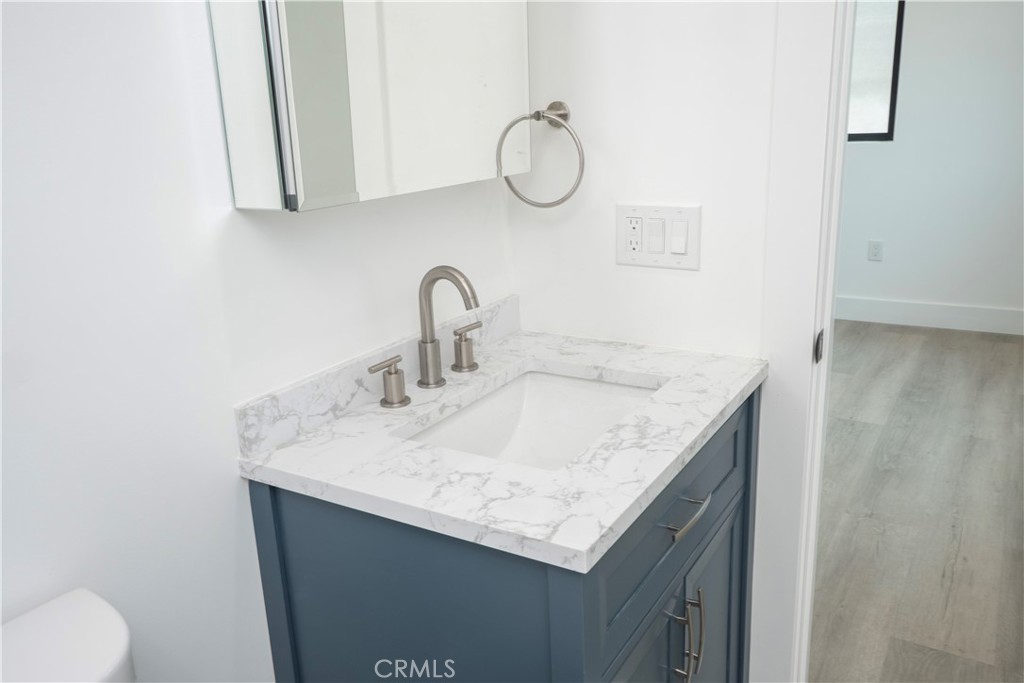1571 Ricardo Street Los Angeles, CA 90033 - Photo 14 of 29 a bathroom with a sink and a mirror